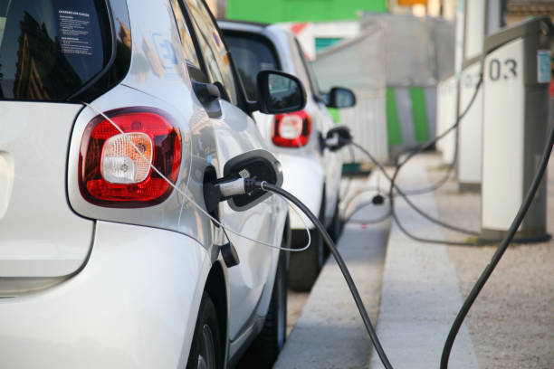 Smart electric car charging at a power station in Paris, France.